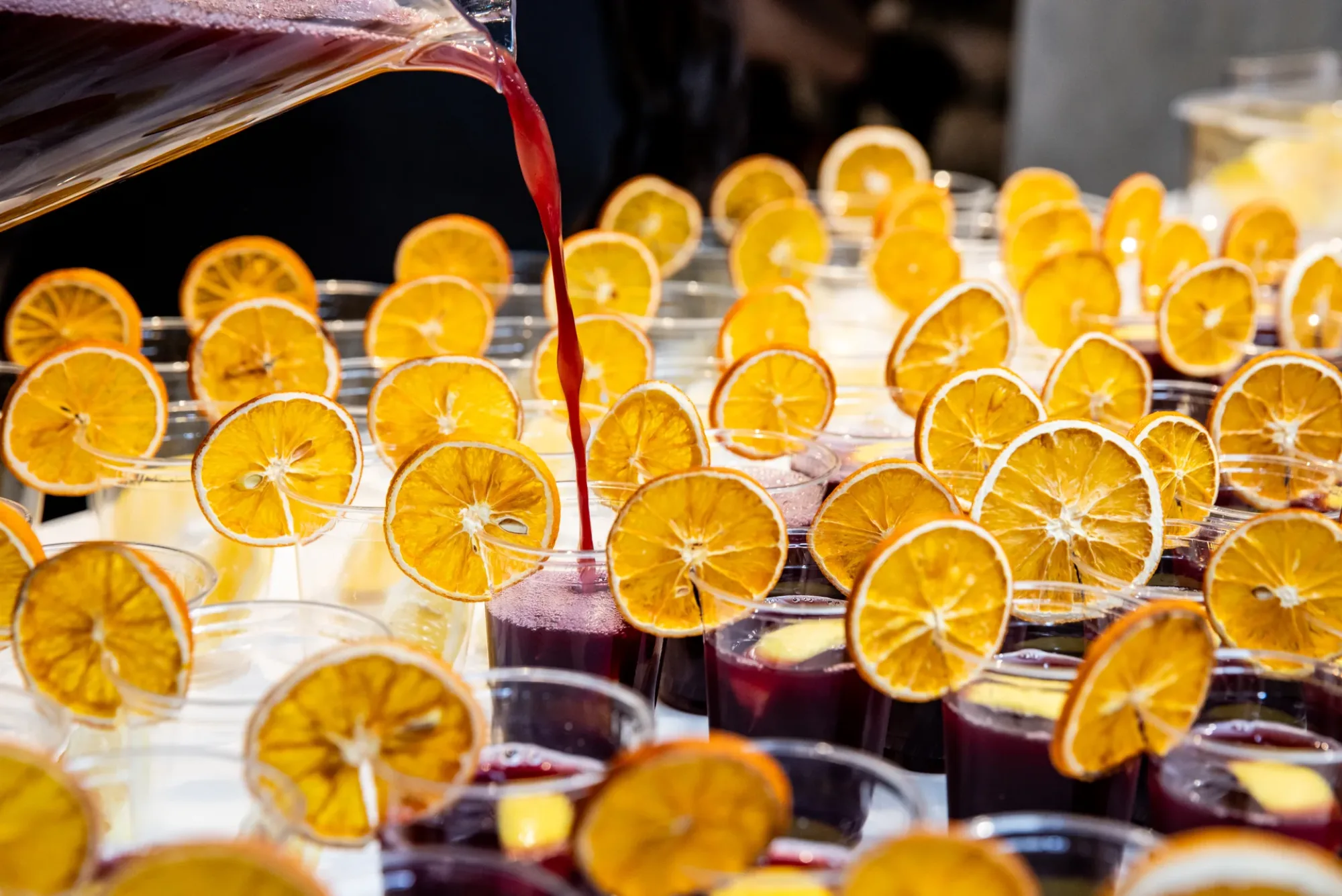A Luv Mocktails bartender pouring a fresh zero-proof build at a Toronto event