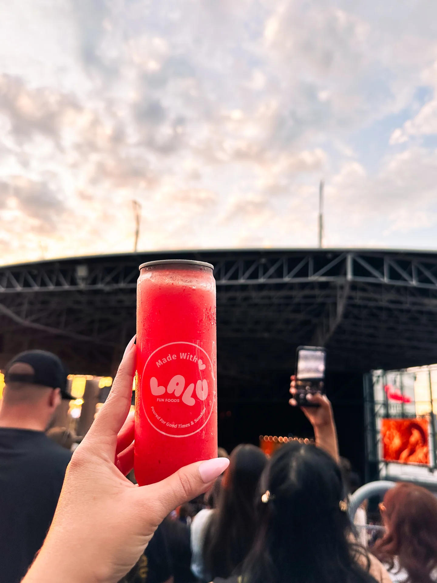 A branded slushie station at a concert activation - drinks poured and canned on-site in custom cups.